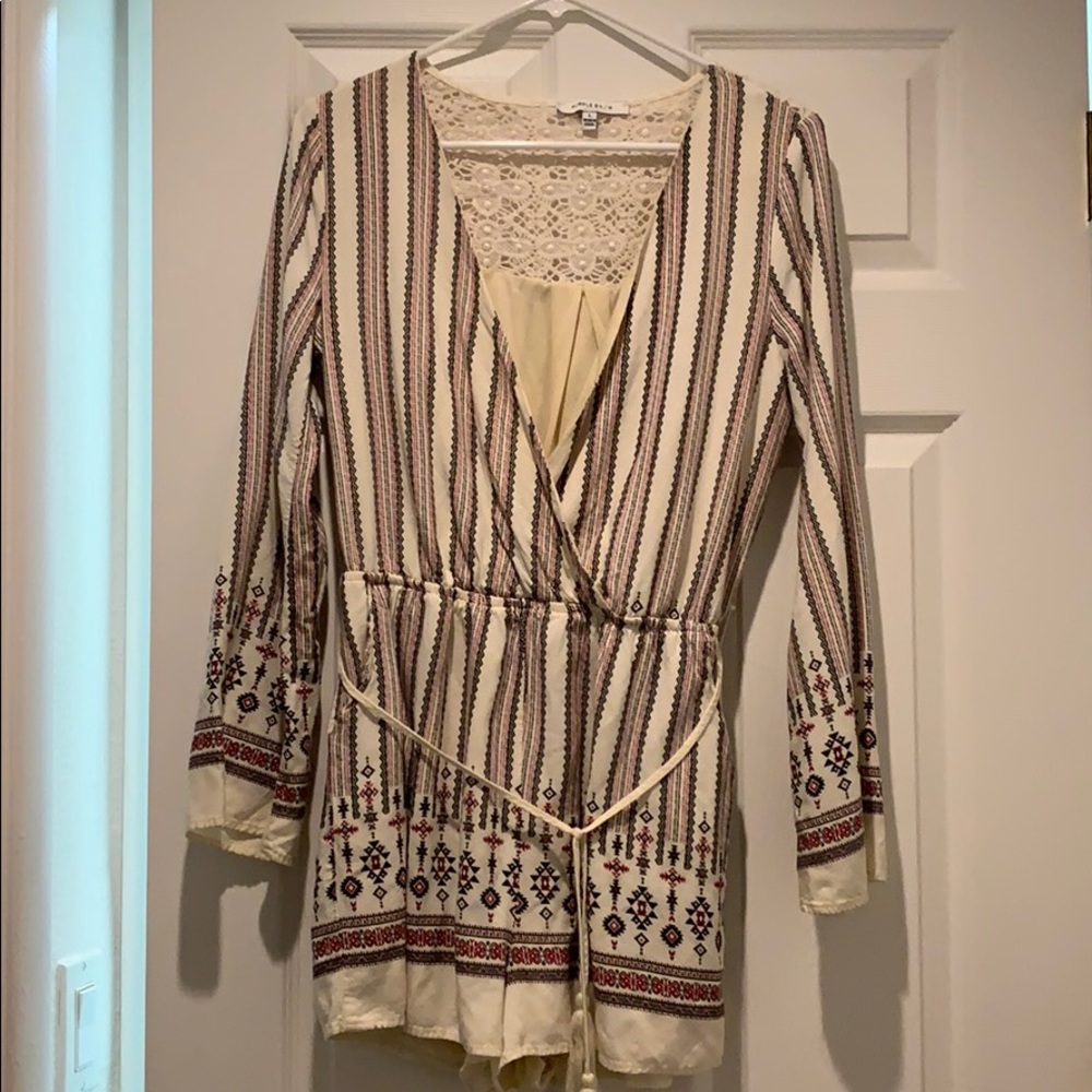 Long sleeve beige romper w/lace back detail